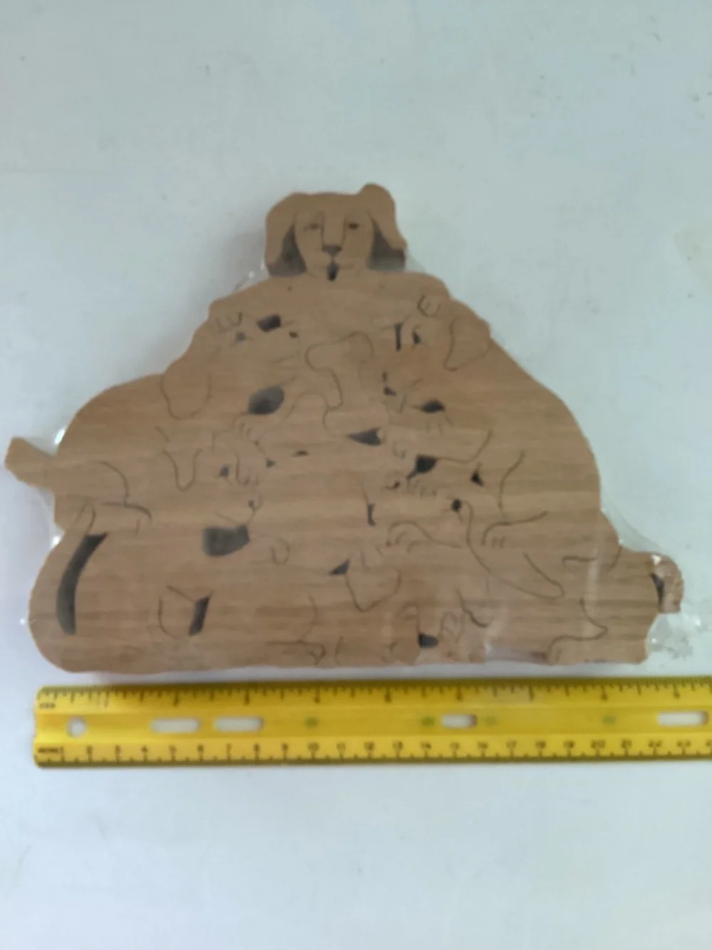 Hans Wooden Dog Shapes puzzle  9 pieces of dogs, bones and a ball